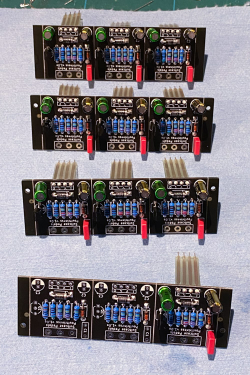 A pile of PCBs mid build